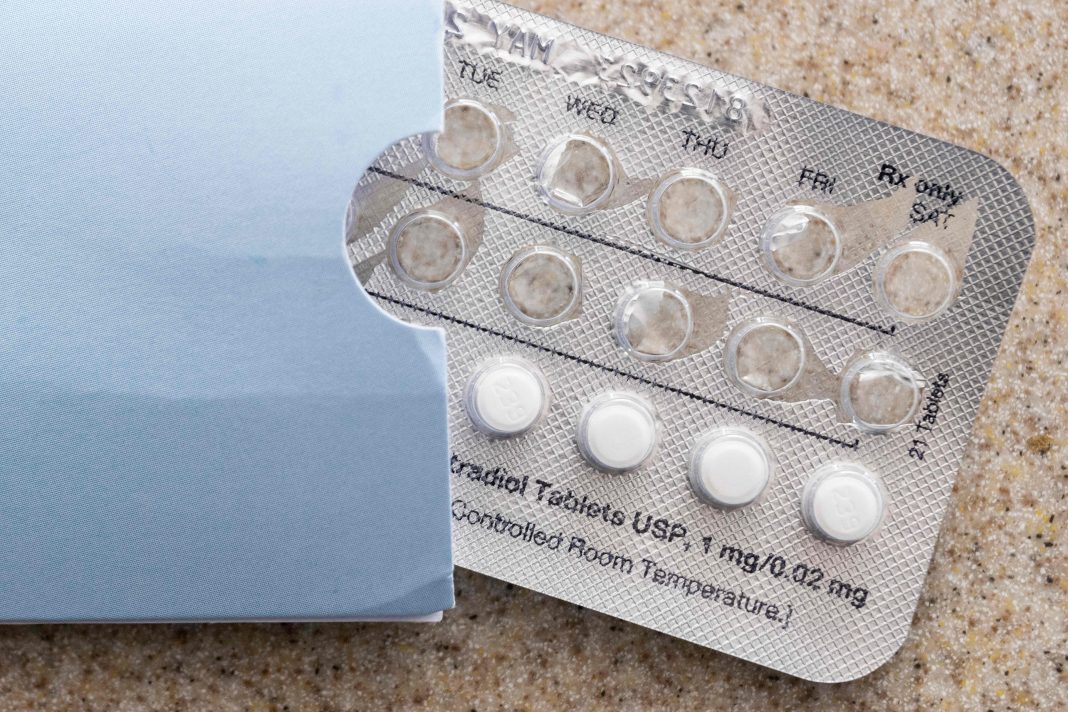 A partially used blister pack of pills is shown on a countertop