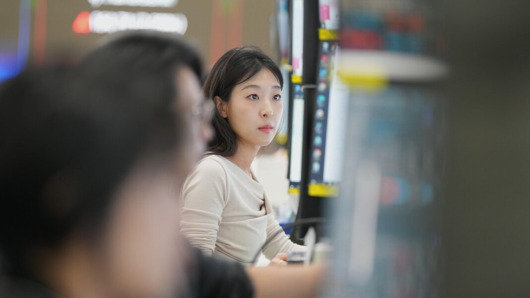 Asian markets are mixed and oil is steady after Wall Street hits records