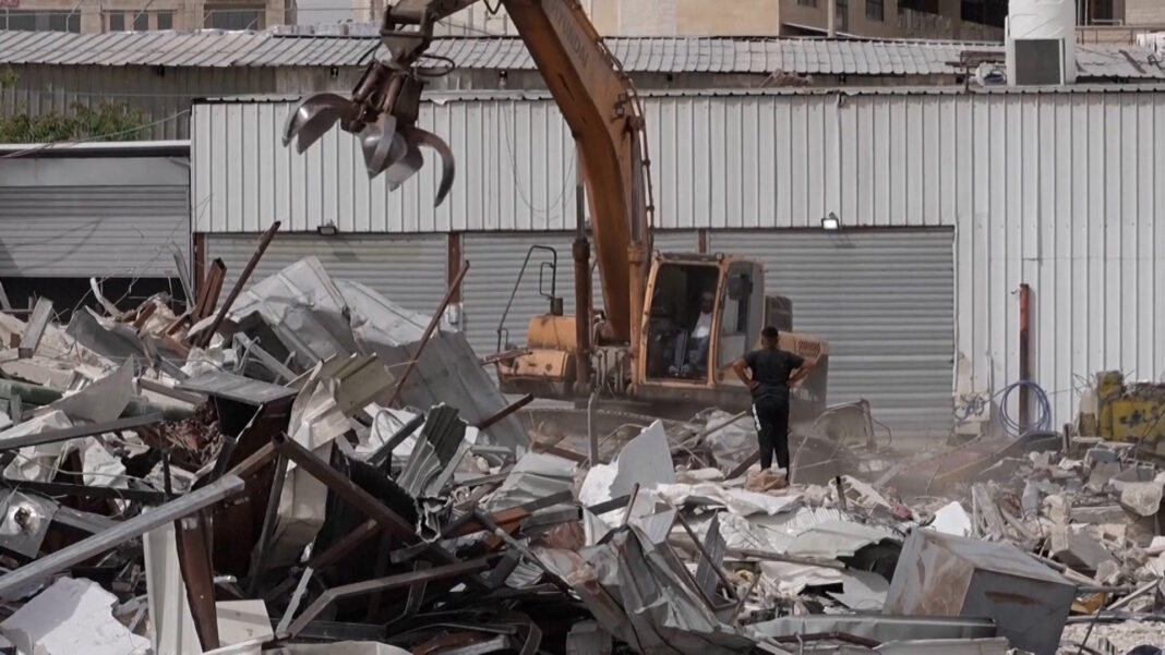 Israel bulldozes Palestinian shops to make way for settlement-linked road | Occupied West Bank